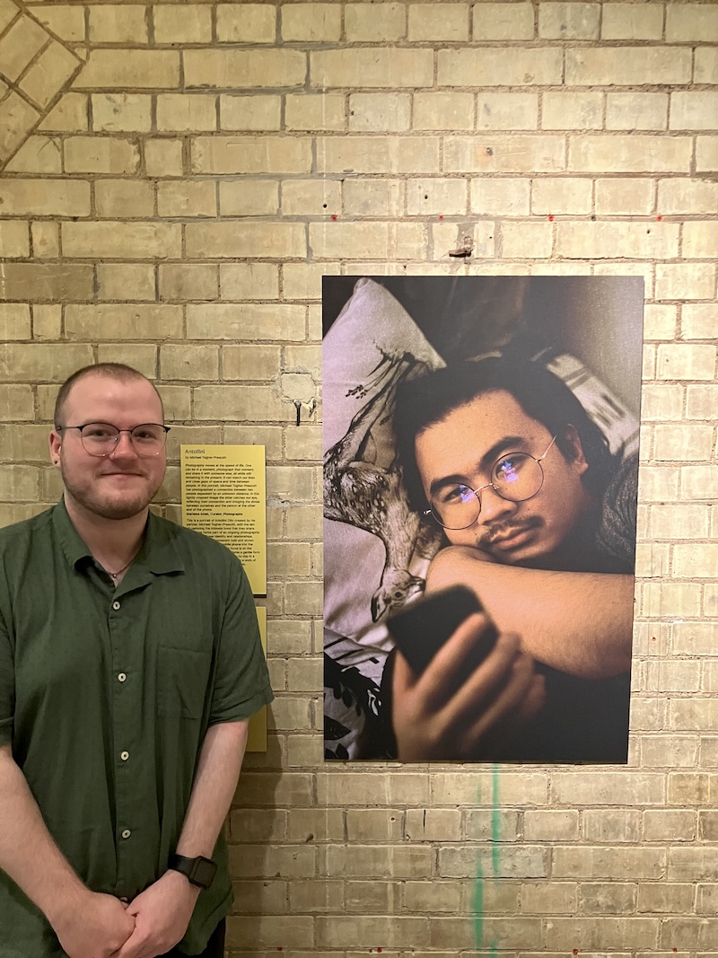Michael Togher Prescott in front of his portrait, 'Antollini Otic'. Photo Portrait Now at NPG